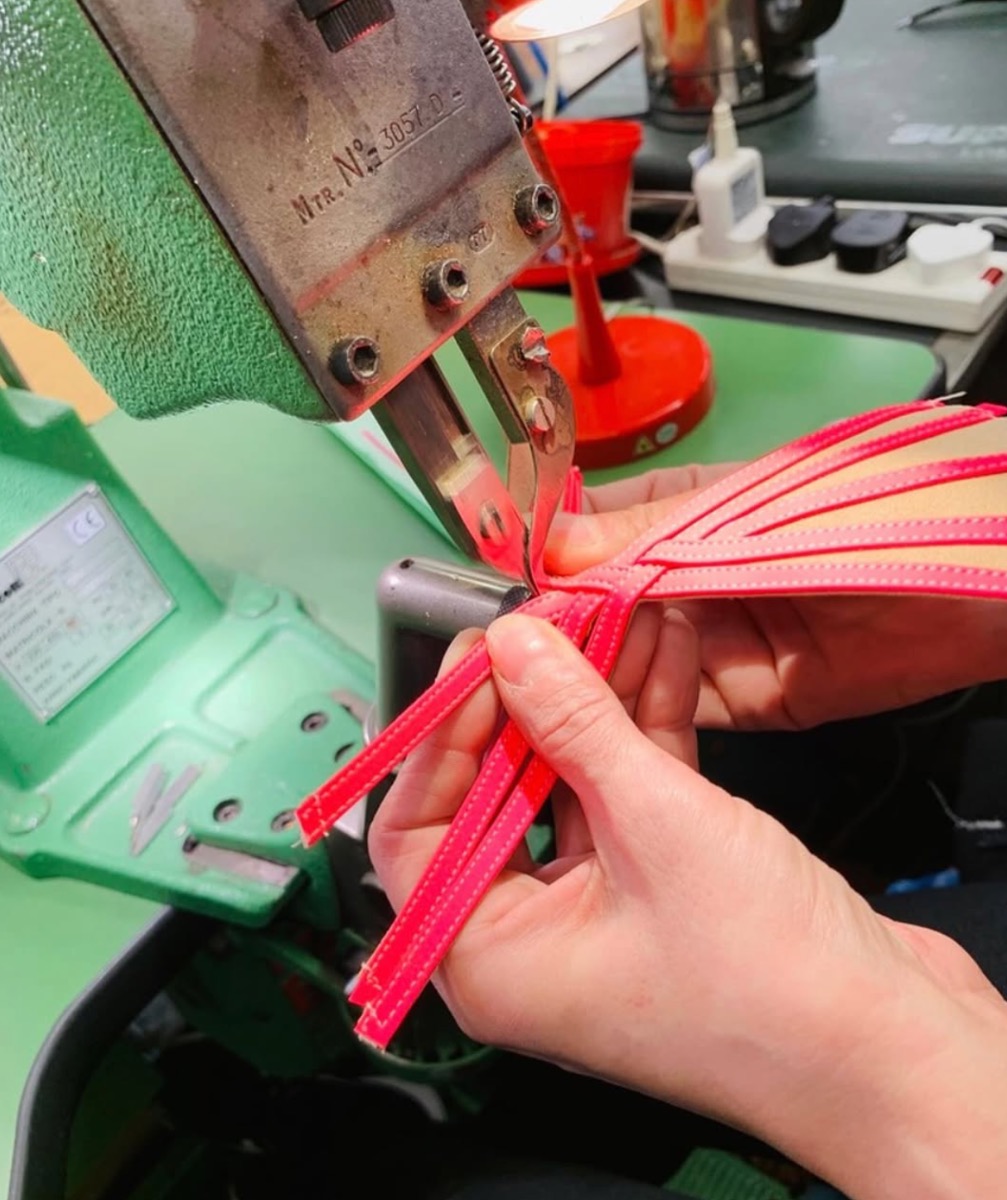 Supadance craftsperson stitching satin straps in the Debden factory